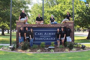 Students at Carl Albert State College Campus Sign